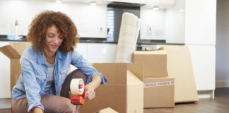 Woman Packing Boxes for Self Storage Unit