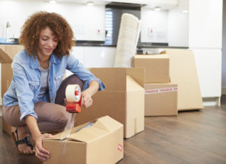 Woman Packing Boxes for Self Storage Unit