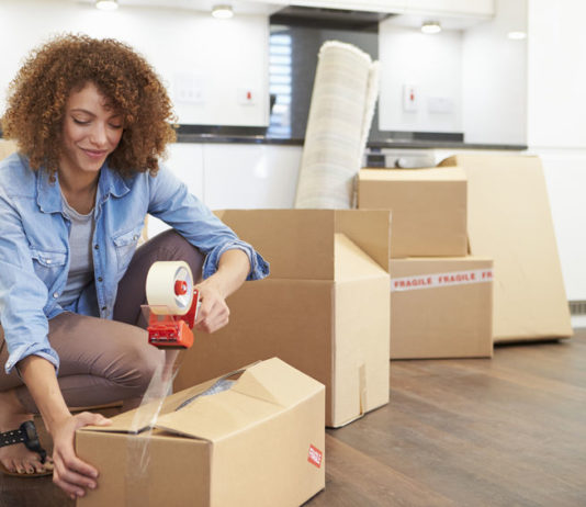 Woman Packing Boxes for Self Storage Unit